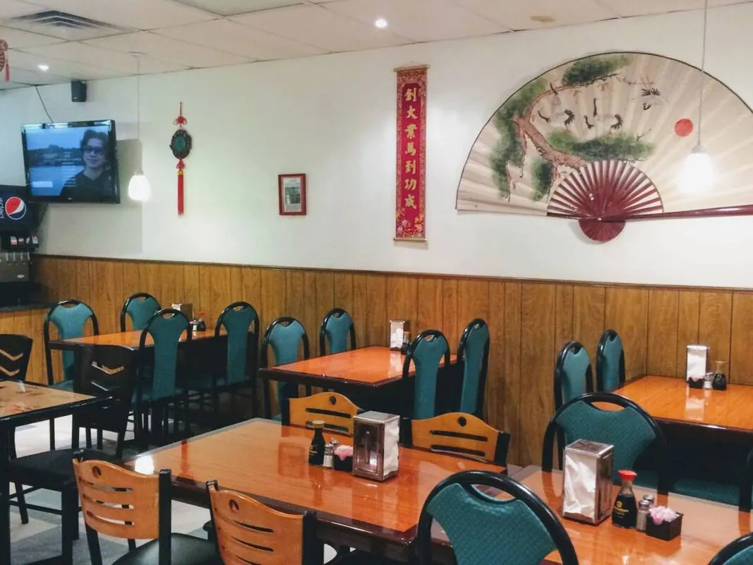 The wok line at China Dragon — chefs cooking over high-heat woks